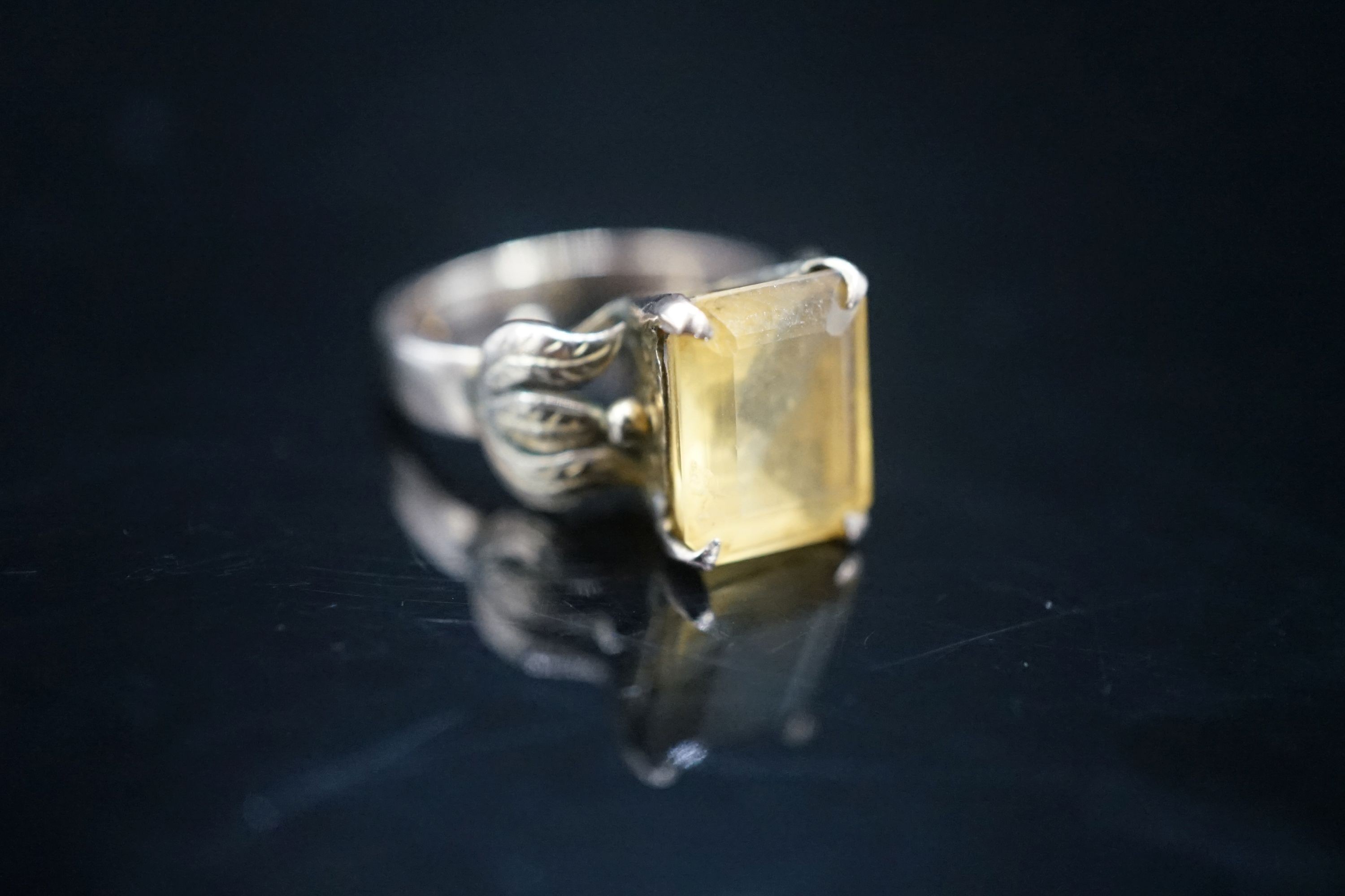 A 14k yellow metal and citrine set dress ring, size M, gross 4.9 grams.